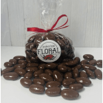 Bag of chocolate-covered candies tied with a red ribbon