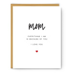 White greeting card for mom with black text and a small red heart, paired with a kraft envelope