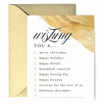 Holiday greeting card with gold design and checklist of December celebrations and matching envelope.