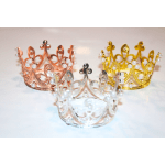 Three decorative crowns in rose gold, silver, and gold