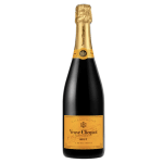 Bottle of champagne with gold foil top and orange label on dark glass