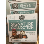 Boxes of assorted chocolates stacked together