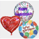 Three birthday balloons, including a red heart balloon and two round balloons.
