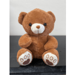 Brown teddy bear plush toy with white muzzle and paw pads