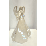 Ceramic angel figurine with cutout wings and a long gown