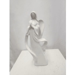 White ceramic angel figurine on a plain surface