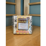 Wrapped chocolate bar on a wooden table