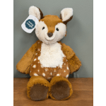 Plush deer toy with a Mary Meyer tag sitting on a wooden surface