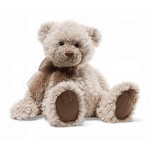 Plush teddy bear sitting on a white background
