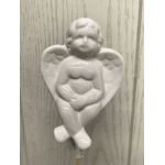 White ceramic angel figurine with a heart-shaped body