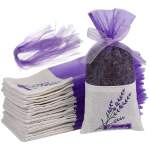 Lavender sachets tied with purple mesh ribbon and stacked cloth pouches