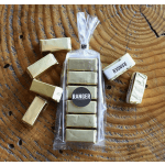 Wrapped candy bars and gold foil chocolates arranged around a clear gift bag