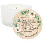 White candle with a floral anniversary label