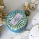 Blue candle tin with seashells and dried coral decor
