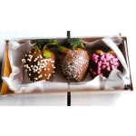 Box of chocolate-covered strawberries with white and pink sprinkles