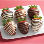 Chocolate-covered strawberries on a white tray
