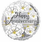 Round anniversary balloon with white flowers and black lettering