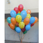 Cluster of colorful birthday balloons with curling ribbons