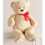 Plush teddy bear with a red ribbon bow