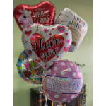 Cluster of birthday and love-themed foil balloons