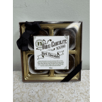 Box of four dark chocolates tied with a black ribbon