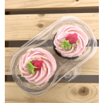 Two pink frosted cupcakes in a clear plastic container