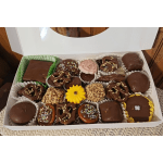 Box of assorted chocolate-covered candies and decorated treats