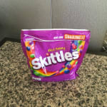 Purple Skittles candy bag on a countertop