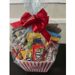 Popcorn bucket gift basket with assorted candy and a red bow