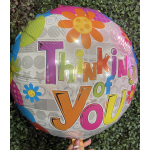 Round foil balloon with colorful flowers and the words Thinking of You