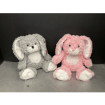 Two plush bunny toys, one gray and one pink, sitting side by side