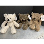 Three plush teddy bears sitting side by side