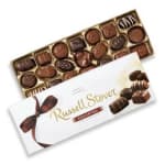 Box of assorted chocolates with a white ribboned sleeve