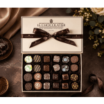 Box of assorted chocolates tied with a brown ribbon