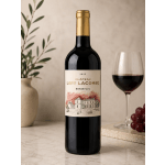 Bottle of red wine beside a glass of wine and grapes