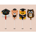 Four graduation-themed foil balloons shaped like a cap, bear, owl, and owl.