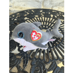 Gray plush shark toy with a Ty tag on a black metal table