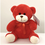 Red teddy bear with a ribbon bow and tag