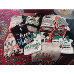 Stack of graphic T-shirts laid out on a table