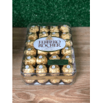 Box of Ferrero Rocher chocolates in gold wrappers