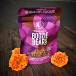 Bag of chocolate-covered gummy bears with two orange roses