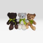 Three teddy bears with green ribbons on a white background