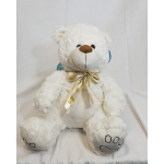 White teddy bear with a gold ribbon bow