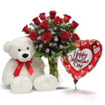 Red rose bouquet with a teddy bear and heart-shaped Valentine balloon