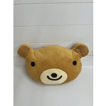 Brown teddy bear face plush pillow with black eyes and a smiling muzzle