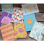 Assorted greeting cards with colorful birthday, baby, and sympathy designs