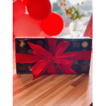 Box of chocolates tied with a red ribbon and bow