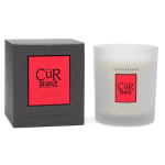 Boxed candle beside a frosted glass candle jar