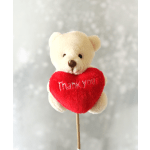 Small cream teddy bear on a stick holding a red heart with 'Thank you' text