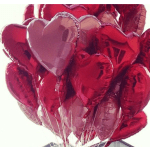 Cluster of red and pink heart-shaped balloons